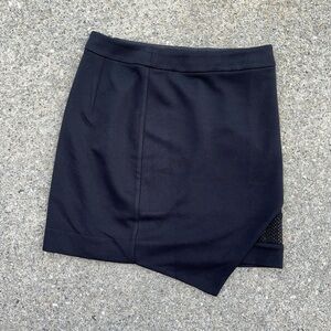 Black pencil skirt with split illusion and mesh detailing